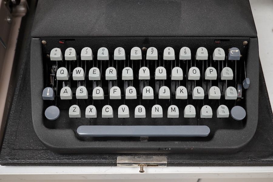 Three cased typewriters; a German Gossen Tippa, a Remington Travel-Riter and a German (U.S. Zone) Blue Bird. Condition - fair to good.